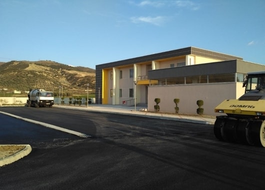 Supply and placement of HDPE DN 63-225mm pipes. Supply and placement of DCI DN 200-400 mm cast iron pipes, including connecting fittings. Supply and placement of DCI DN 700 cast iron pipes with self-anchoring type joints. Supply and placement of cast iron and polyethylene fittings with electrophoresed welding, cable ties, portcullis/hydrants, metering devices, etc. Construction Works Customer connection including meters and corresponding DN 20-63 mm fittings. Construction and furnishing of the administrative building of Berat-Kuçova Water Supply and Sewerage, including civil, mechanical (HVAC, fire, sanitary, etc.), and electrical works. DN 700 cast iron pipeline placement in rugged mountainous terrain has been successfully implemented within the set deadlines. During the implementation of this project, special care and attention have been paid to the works in the historic district of Mangalem with the primary objective of preserving a significant area of our cultural heritage protected by UNESCO.